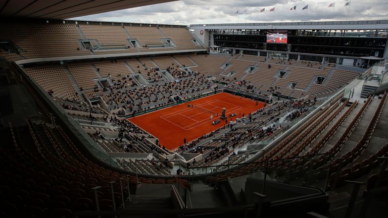 View of center court Philippe Chatrier where Poland's Iga Swiatek waits for Sofia Kenin of the U.S. to return from medical treatment in the final match of the French Open tennis tournament at the Roland Garros stadium in Paris, France, Saturday, Oct. 10, 2020. (AP Photo/Alessandra Tarantino)