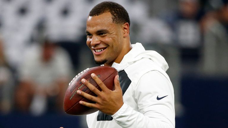 Dallas Cowboys quarterback Dak Prescott smiles as he stands on the field during warm ups before an NFL football game against the Philadelphia Eagles on Sunday, Oct. 30, 2016, in Arlington, Texas. (AP Photo/Michael Ainsworth)