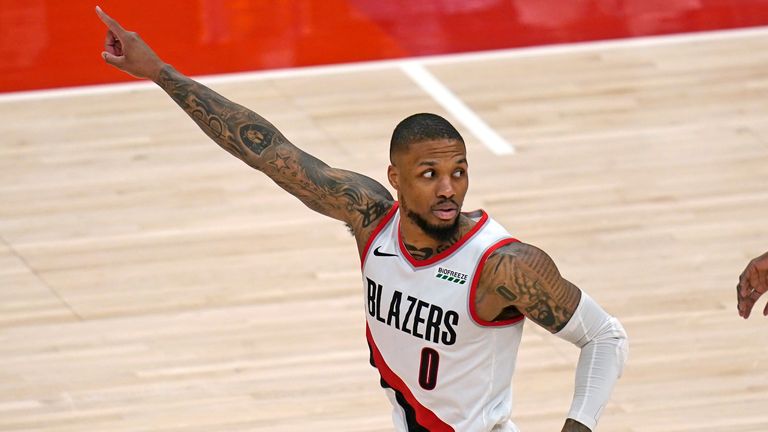 Portland Trail Blazers guard Damian Lillard runs upcourt after scoring