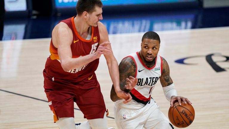 Portland Trail Blazers guard Damian Lillard and Denver Nuggets center Nikola Jokic during Game 1 in Denver