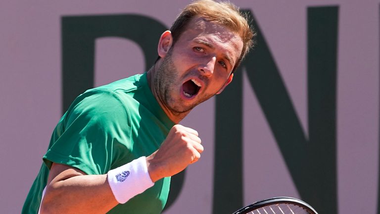 Dan Evans celebrates a winning point as he plays Serbia's Miomir Kecmanovic during their first round match of the French Open tennis tournament at the Roland Garros stadium Sunday, May 30, 2021 in Paris. (AP Photo/Michel Euler)