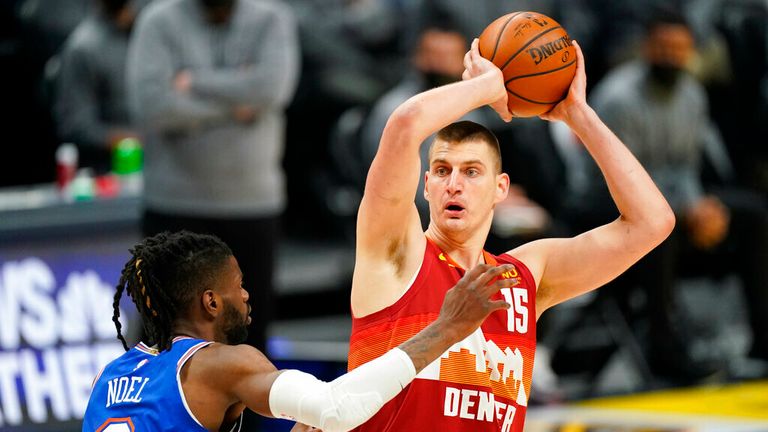 Denver Nuggets center Nikola Jokic (15) looks to pass the ball as New York Knicks center Nerlens Noel (3) defends in the first half of an NBA basketball game Wednesday, May 5, 2021, in Denver. (AP Photo/David Zalubowski)