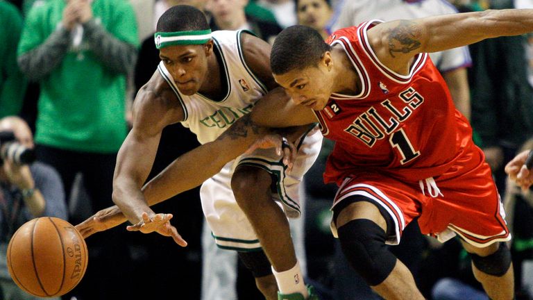 Chicago Bulls guard Derrick Rose and Boston Celtics guard Rajon Rondo fight for control of the ball during the fourth quarter of the opening game of an NBA playoff series in Boston Saturday, April 18, 2009.