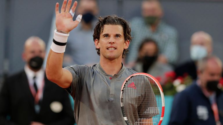 Dominic Thiem of Austria celebrates after defeating Marcos Giron of the U.S. 6-1, 6-3 during their match at the Madrid Open tennis tournament in Madrid, Spain, Tuesday, May 4, 2021. (AP Photo/Paul White)