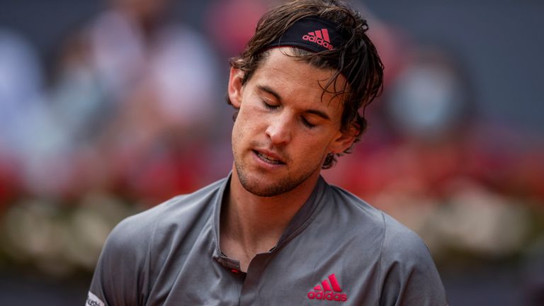 Austria's Dominic Thiem reacts after missing a point against Germany's Alexander Zverev during their semi-final match at the Mutua Madrid Open tennis tournament in Madrid, Spain, Saturday, May 8, 2021. (AP Photo/Bernat Armangue)