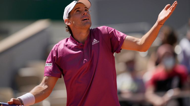Dominic Thiem reacts as he plays Spain's Pablo Andujar during their first round match of the French Open tennis tournament at the Roland Garros stadium Sunday, May 30, 2021 in Paris. (AP Photo/Christophe Ena)