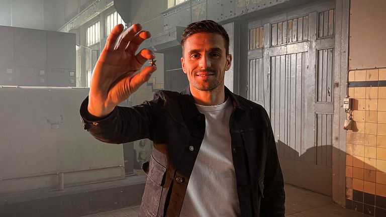 Ajax's Dusan Tadic hold sup the commemorative star which will be sent to all of the club's season-ticket holders