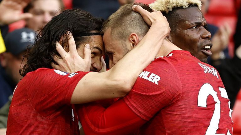 Edinson Cavani celebrates his goal with Luke Shaw and Paul Pogba