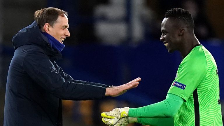 Thomas Tuchel celebrates with Edouard Mendy after the goalkeeper's record eighth clean sheet in the Champions League this season