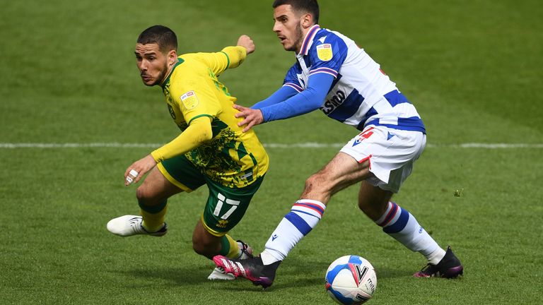 Emi Buendia and Reading's Dejan Tetek vie for the ball at Carrow Road