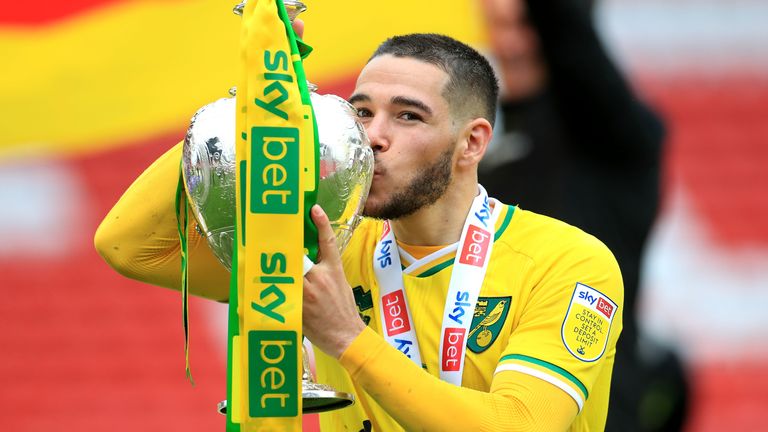 Norwich City's Emiliano Buendia with the Sky Bet Championship trophy