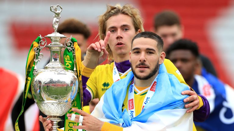 Norwich City's Emiliano Buendia (right) and Todd Cantwell with the Sky Bet Championship trophy