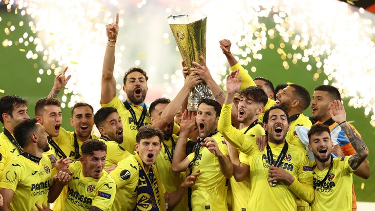 Villarreal players celebrate with trophy after winning the Europa League