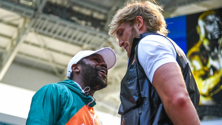 Boxer Floyd Mayweather Jr. (left) and media personality Logan Paul (right) during a media face-off event on Thursday, May 6, 2021 in Miami Gardens, Fla. (Carlos Goldman/Miami Dolphins via AP)