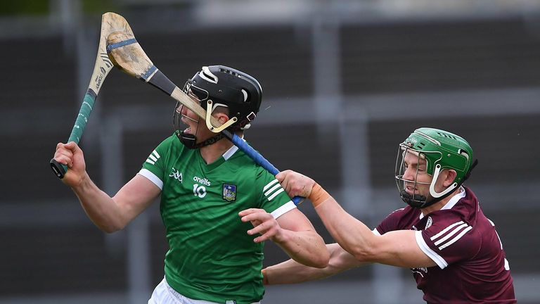 Adrian Tuohey of Galway tackles Gearóid Hegarty of Limerick