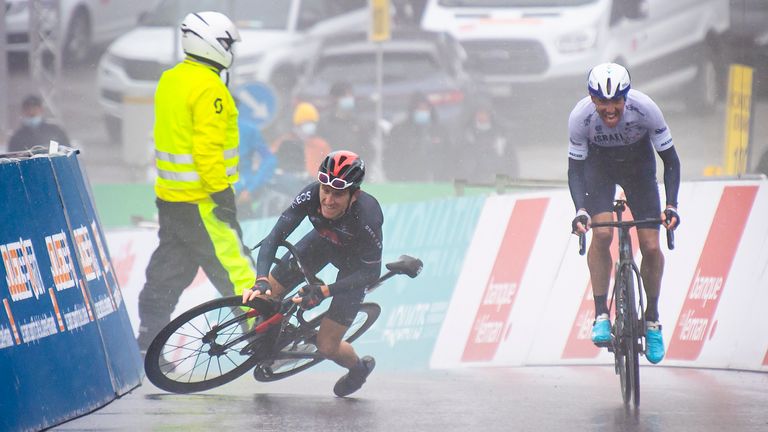 Geraint Thomas falls as stage 4 winner Michael Woods crosses the finish line (AP)