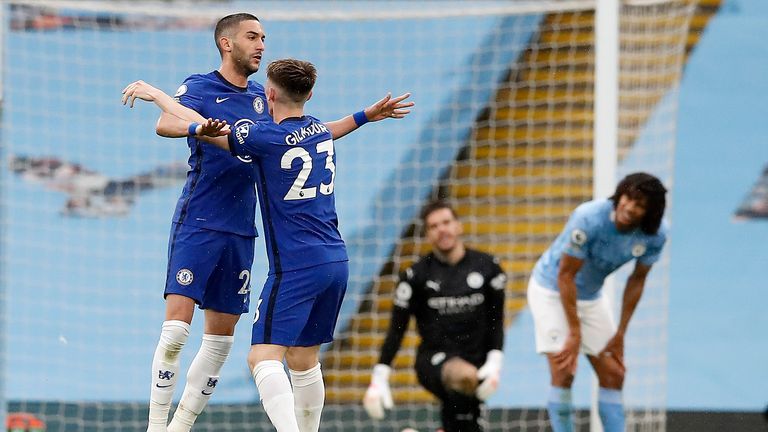 Hakim Ziyech celebrates the equaliser with Billy Gilmour (AP)