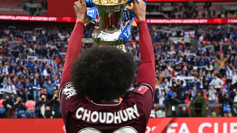Hamza Choudhury of Leicester City celebrates towards the fans with the Emirates FA Cup trophy following The Emirates FA Cup Final match between Chelsea and Leicester City at Wembley Stadium on May 15, 2021 in London, England