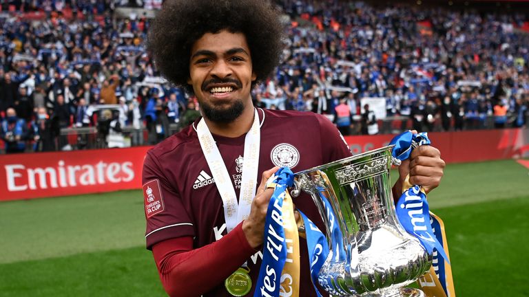  Hamza Choudhury of Leicester City celebrates with the Emirates FA Cup trophy following The Emirates FA Cup Final match between Chelsea and Leicester City at Wembley Stadium on May 15, 2021 in London, England. 