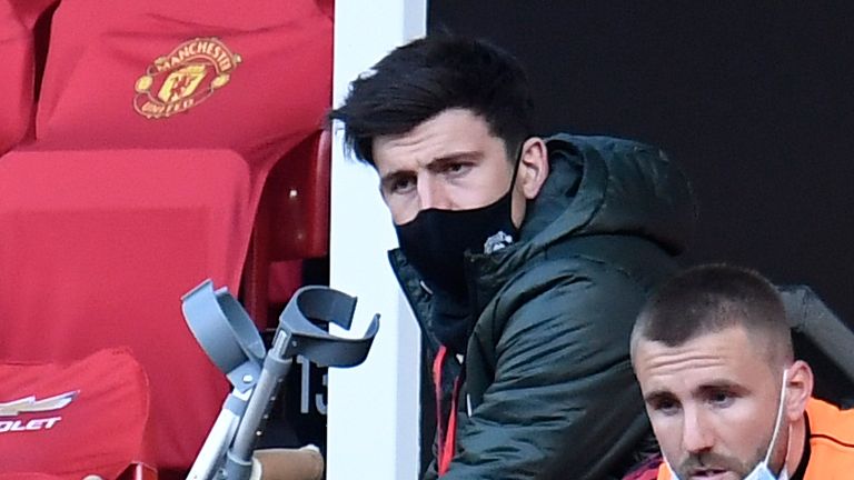 Harry Maguire watches on from the stands during Man Utd's 4-2 defeat to Liverpool