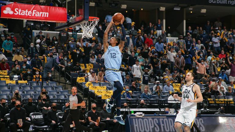 Ja Morant #12 of the Memphis Grizzlies dunks the ball against the Utah Jazz during Round 1, Game 3 of the 2021 NBA Playoffs on May 29, 2021 at FedExForum in Memphis, Tennessee. NOTE TO USER: User expressly acknowledges and agrees that, by downloading and or using this photograph, User is consenting to the terms and conditions of the Getty Images License Agreement. Mandatory Copyright Notice: Copyright 2021 NBAE (Photo by Joe Murphy/NBAE via Getty Images)