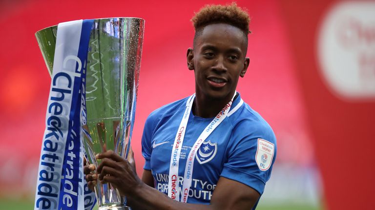 PA - Jamal Lowe lifts the Checkatrade Trophy with Portsmouth