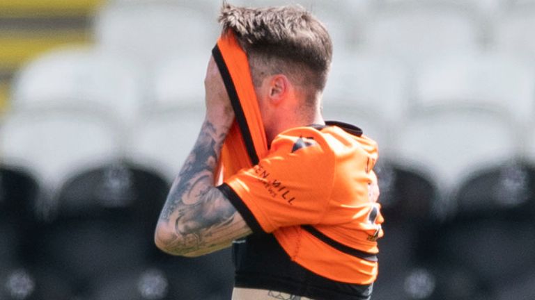 PAISLEY, SCOTLAND - MAY 16: Dundee United's Jamie Robson leaves the field after being sent off during the Scottish Premiership match between St Mirren and Dundee Utd at the SMISA Stadium, on May 16, 2021, in Paisley, Scotland. (Photo by Mark Scates / SNS Group)