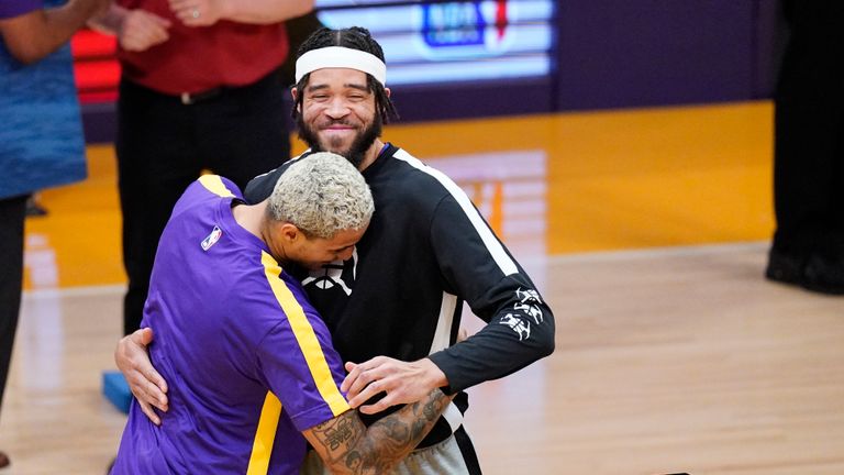 JaVale McGee and Kyle Kuzma embrace before Nuggets @ Lakers