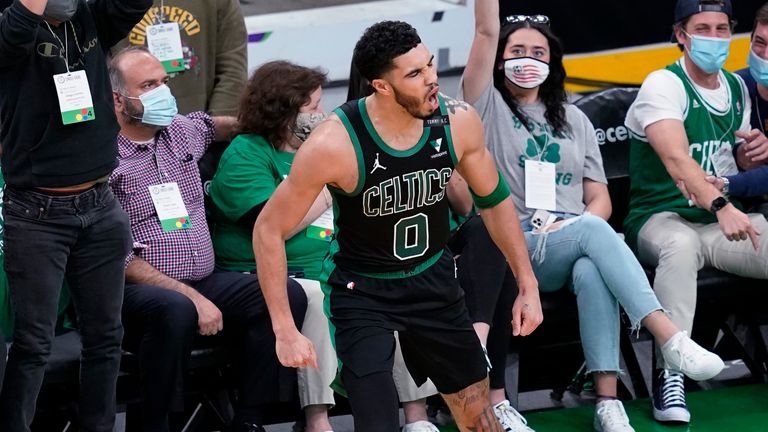 Boston Celtics forward Jayson Tatum celebrates his made basket with fans in Game 3 against the Brooklyn Nets during an NBA basketball first-round playoff series