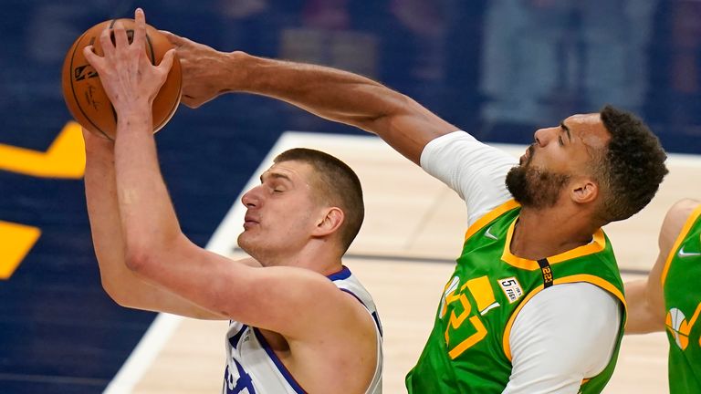 Utah Jazz center Rudy Gobert defends against Denver Nuggets center Nikola Jokic