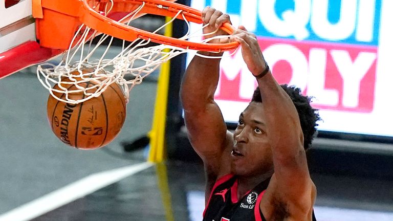 Toronto Raptors forward Stanley Johnson dunks against the Chicago Bulls during the first half of an NBA basketball game in Chicago, Thursday, May 13, 2021.