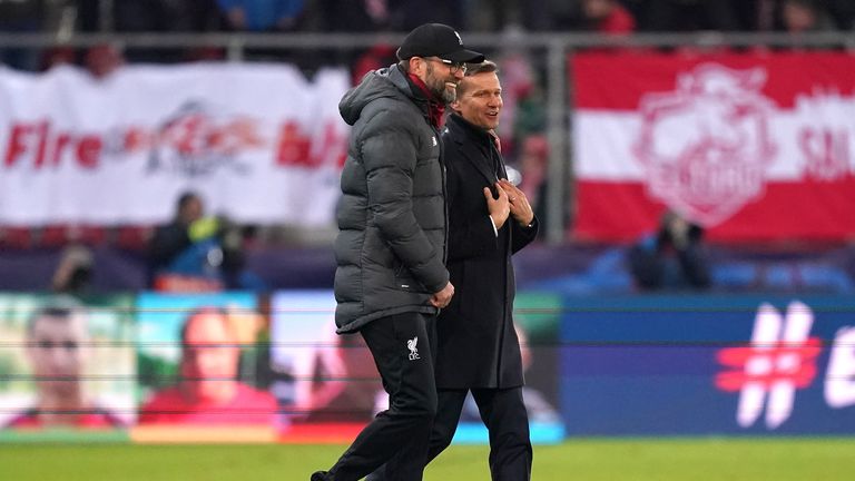 Liverpool manager Jurgen Klopp walks with RB Salzburg boss Jesse Marsch