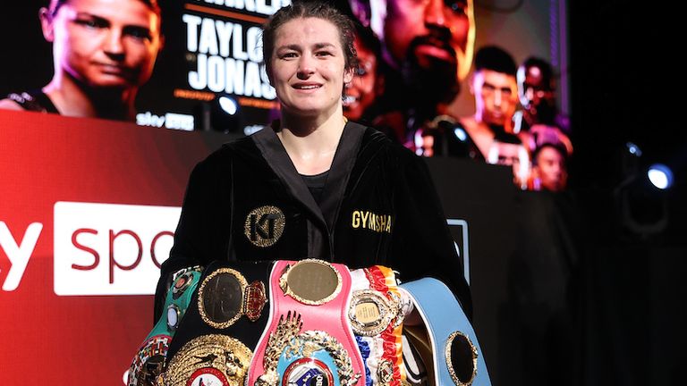*** FREE FOR EDITORIAL USE ***.Katie Taylor vs Natasha Jonas, WBC, WBA, IBF and WBO Female Lightweight Title Fight..1 May 2021.Picture By Mark Robinson Matchroom Boxing..Katie Taylor celebrates with Eddie Hearn and her team after her victory. 