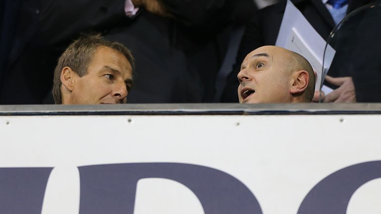 Jurgen Klinsmann talks with Daniel Levy in the Tottenham directors box in 2012