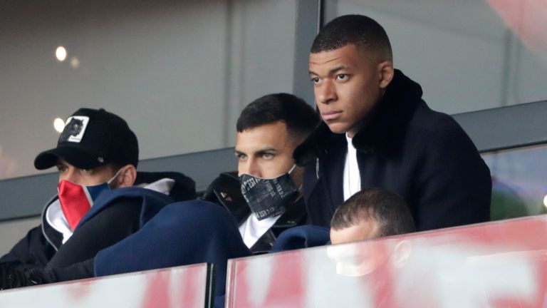 Kylian Mbappe watches on from the stands, absent through injury