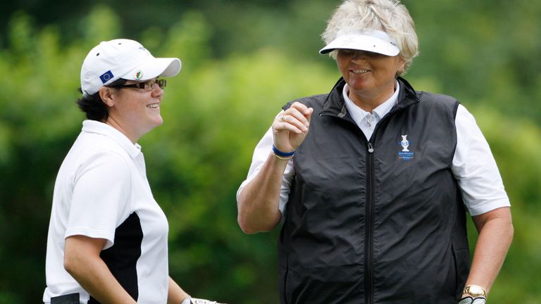 Team Europe's Laura Davies of Britain, right, smiles with Becky Brewerton of Britain after teeing off on the fifth hole during a four-ball match at the Solheim Cup golf tournament Friday, Aug. 21, 2009, at Rich Harvest Farms in Sugar Grove, Ill. (AP Photo/Mike Groll) 