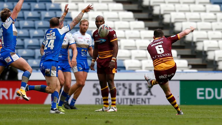 Lee Gaskell kicks a drop goal to win the match for Huddersfield