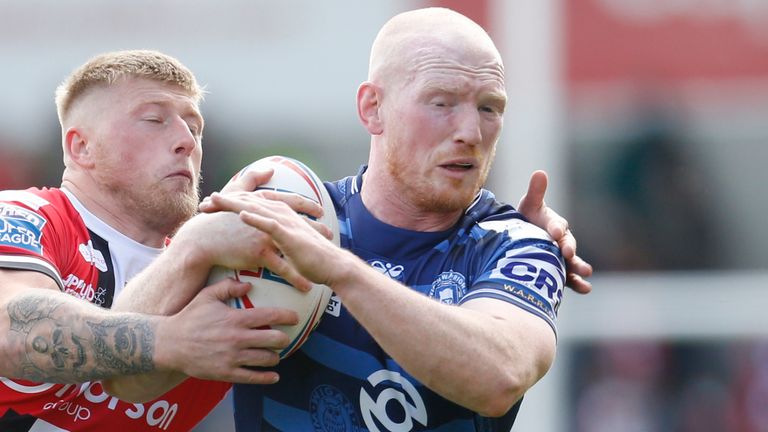 Picture by Ed Sykes/SWpix.com - 22/05/2021 - Rugby League - Betfred Super League Round 7 - Salford Red Devils v Wigan Warriors - AJ Bell Stadium, Salford, England - Wigan Warriors' Liam Farrell in action with Salford Red Devils' Danny Addy