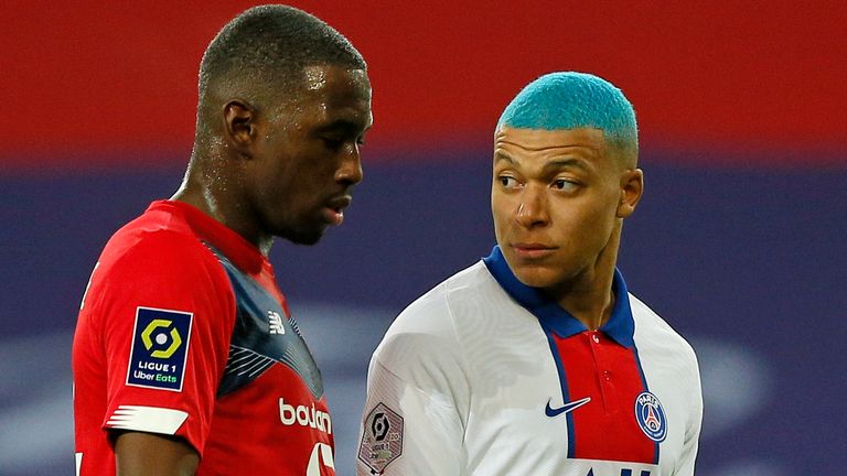 Boubakary Soumare marking Kylian Mbappe in a match back in December - Lille pipped PSG to the Ligue 1 title by one point