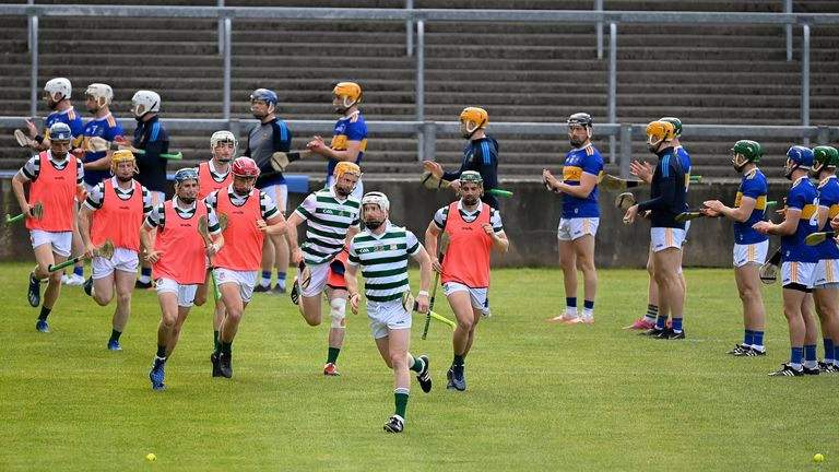 Tipperary players provide a guard of honour for All-Ireland champions Limerick ahead of the match