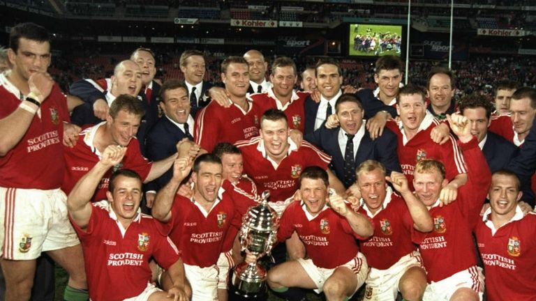 The Lions of 1997 celebrate their series win.