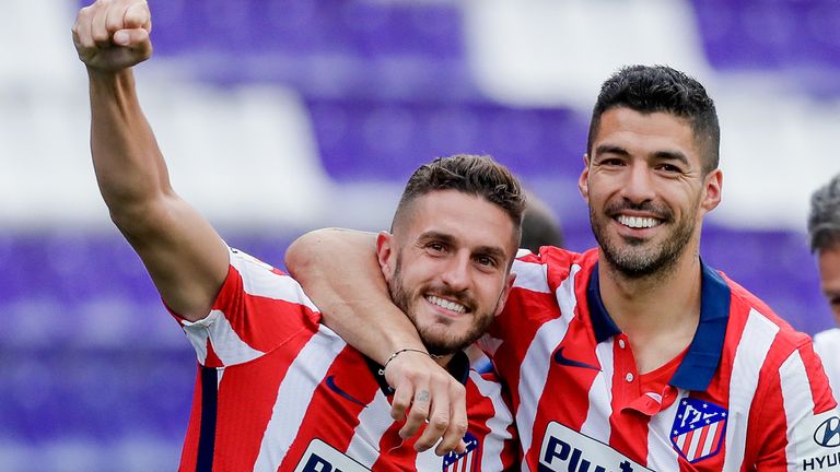 Koke and Luis Suarez celebrate Atletico Madrid's La Liga triumph