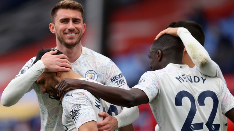 Sergio Aguero is congratualted by his Man City team-mates at Crystal Palace