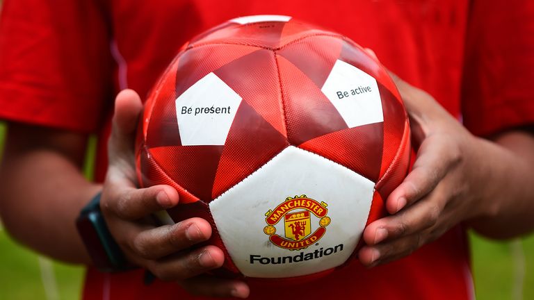 To accompany the book from the Manchester United Foundation is a small football that features wellbeing phrases