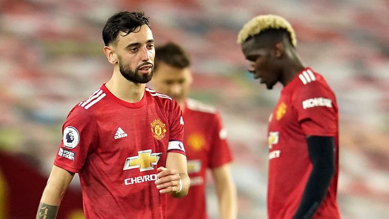 Manchester United's Bruno Fernandes and Paul Pogba appear dejected after Liverpool's fourth goal at Old Trafford