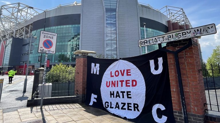 A banner is placed outside Old Trafford in protest at the club's owners, The Glazers