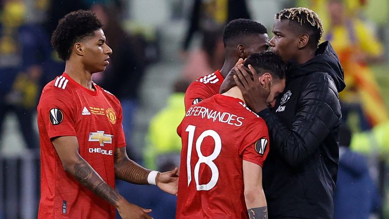 Manchester United players react after losing the Europa League fiinal on penalties