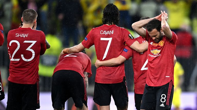 Manchester United players react during the penalty shootout in the Europa League final