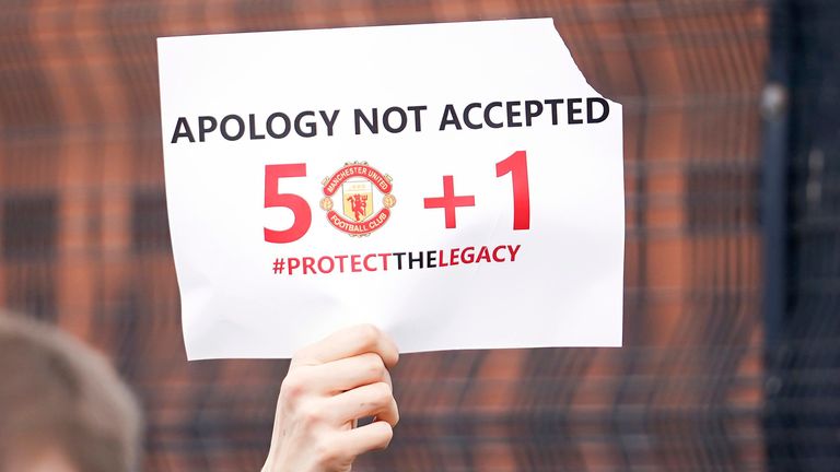 Manchester United fans prevent cars arriving at Old Trafford, during a protest against the Glazer family, owners of Manchester United, before their Premier League match against Liverpool at Old Trafford, Manchester, England, Sunday, May 2, 2021.