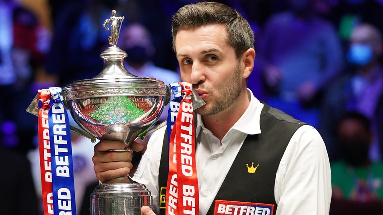 Mark Selby of England celebrates with the trophy following his victory during the Final between Shaun Murphy and Mark Selby on day seventeen of the Betfred World Snooker Championship at the Crucible Theatre on May 3, 2021 in Sheffield, England. (Photo by Zac Goodwin - Pool/Getty Images)